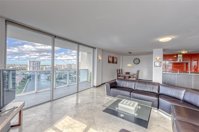 living area featuring a view of city and expansive windows