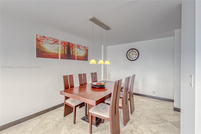 dining space with baseboards
