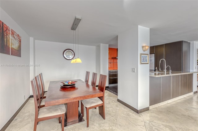 3800 S Ocean Dr Unit 1606, Hollywood, FL 33019 - dining area with baseboards
