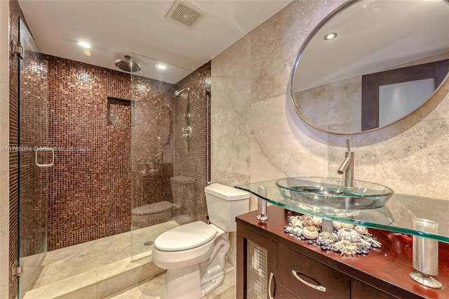 full bathroom featuring tile patterned flooring, vanity, toilet, a shower stall, and visible vents