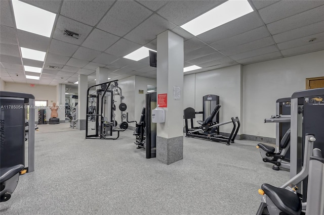 gym with visible vents and a drop ceiling
