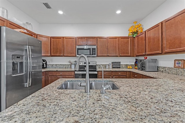 5301 Ellery Ter, West Palm Beach, FL 33417 - kitchen with visible vents, recessed lighting, appliances with stainless steel finishes, and light stone counters