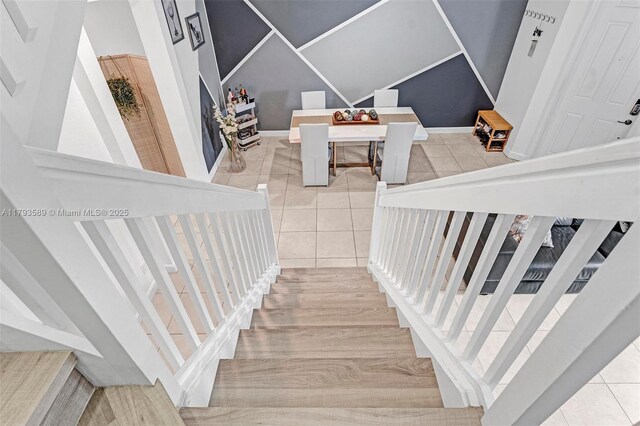 5301 Ellery Ter, West Palm Beach, FL 33417 - stairway featuring tile patterned floors and baseboards