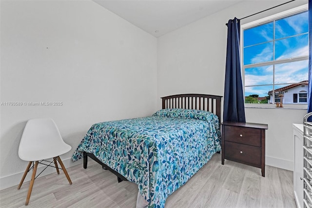 5301 Ellery Ter, West Palm Beach, FL 33417 - bedroom featuring baseboards and light wood finished floors