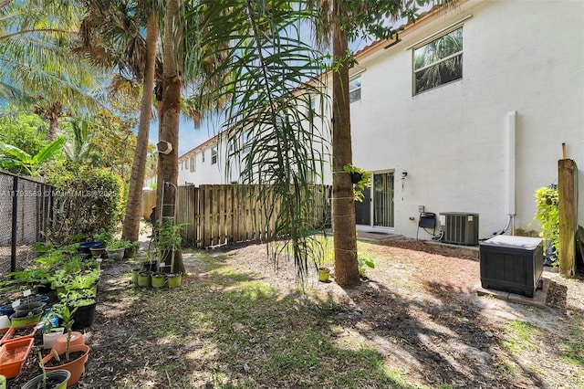 5301 Ellery Ter, West Palm Beach, FL 33417 - view of yard with central AC and a fenced backyard