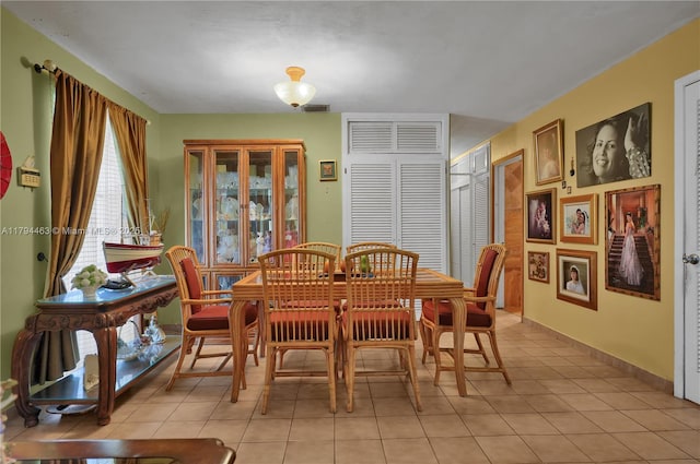 dining room featuring light tile patterned floors and visible vents
