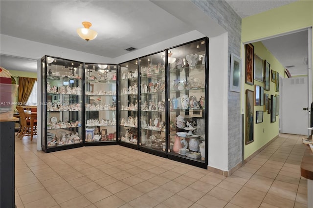 interior space featuring visible vents and tile patterned flooring