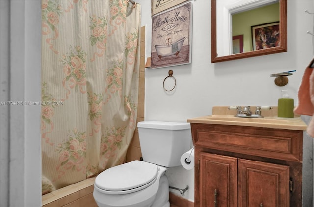 bathroom with vanity, tile patterned flooring, toilet, and a shower with curtain