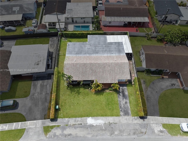 birds eye view of property with a residential view