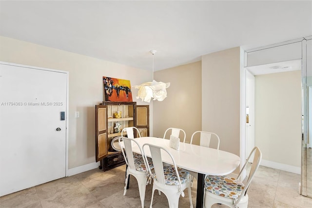dining room with baseboards