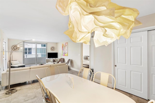 dining room with baseboards