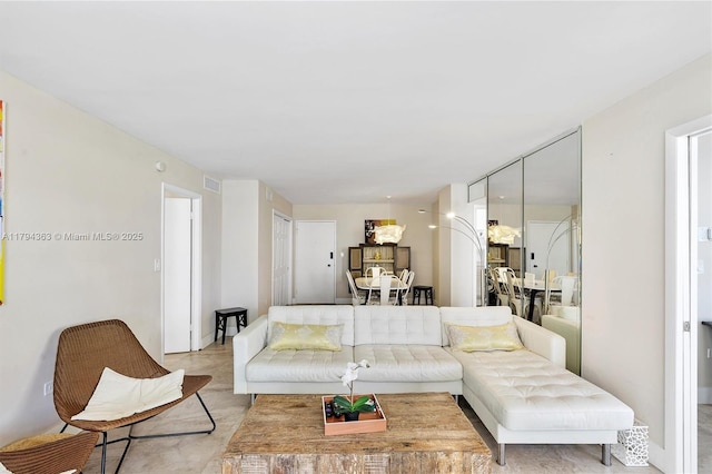 living area featuring visible vents
