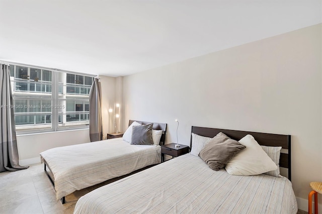 bedroom featuring baseboards