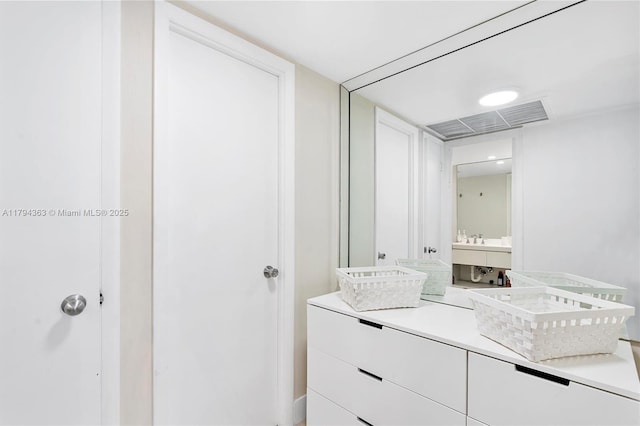 bathroom with vanity and visible vents