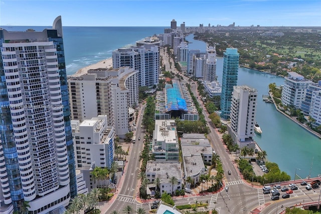 bird's eye view featuring a water view and a view of city