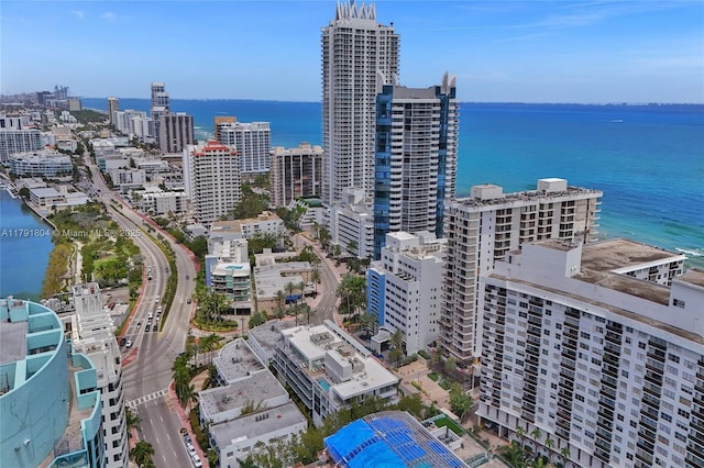 drone / aerial view featuring a water view and a city view