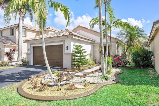 1371 Canary Island Dr, Weston, FL 33327 - mediterranean / spanish-style home with a front lawn, stucco siding, a tiled roof, an attached garage, and driveway