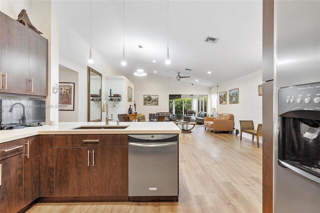 1371 Canary Island Dr, Weston, FL 33327 - kitchen with ceiling fan, appliances with stainless steel finishes, vaulted ceiling, a sink, and a peninsula