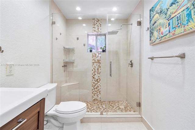 1371 Canary Island Dr, Weston, FL 33327 - bathroom featuring vanity, a textured wall, toilet, tile patterned floors, and a stall shower