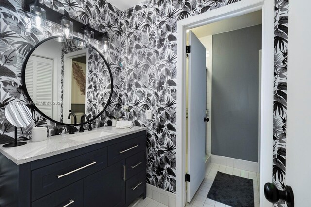 6255 SW 99th Ter, Pinecrest, FL 33156 - bathroom featuring baseboards, vanity, and wallpapered walls