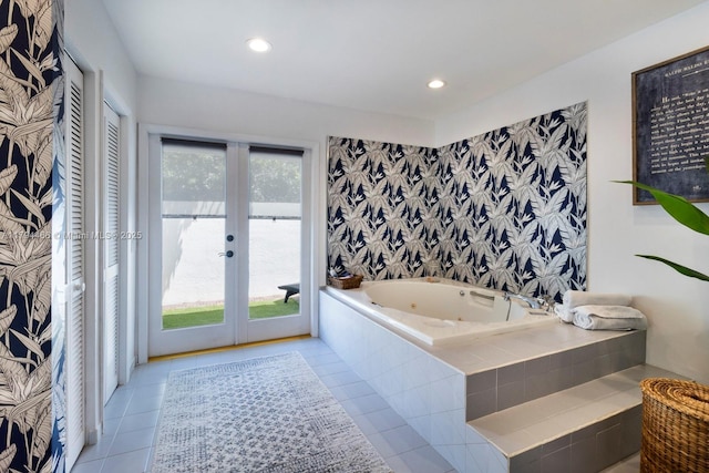 full bath with recessed lighting, tile patterned floors, french doors, and a jetted tub
