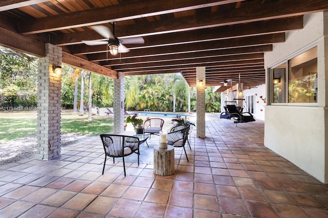 view of patio featuring a ceiling fan and an outdoor pool