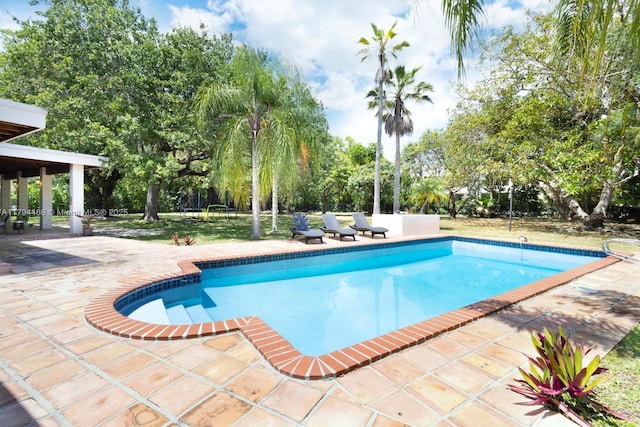 pool with a patio