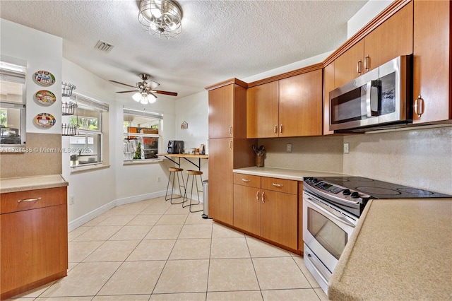 kitchen with visible vents, light countertops, a healthy amount of sunlight, and stainless steel appliances