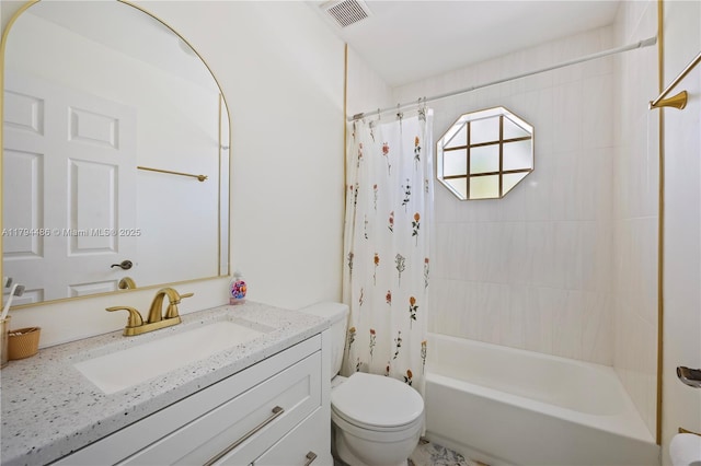 full bath with vanity, shower / bath combo with shower curtain, toilet, and visible vents