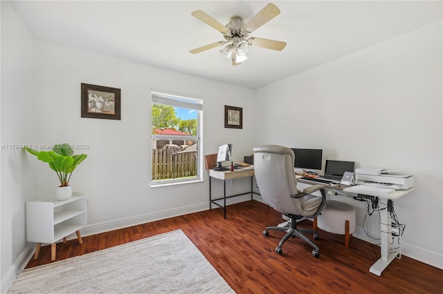 home office with baseboards, a ceiling fan, and wood finished floors