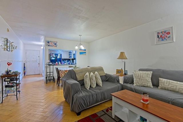 living area with a chandelier