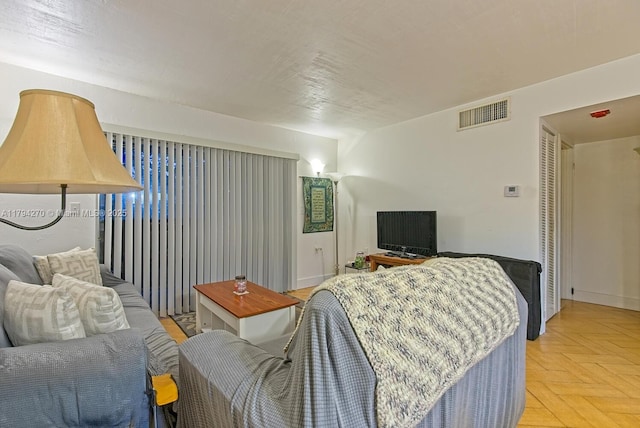 living area featuring visible vents