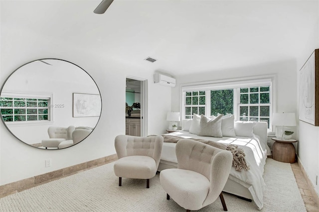1161 Sunset Dr, Coral Gables, FL 33143 - bedroom with a wall mounted air conditioner, baseboards, a ceiling fan, and connected bathroom
