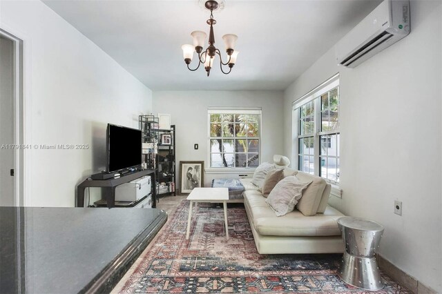 1161 Sunset Dr, Coral Gables, FL 33143 - living area with a wall mounted air conditioner, a chandelier, and baseboards