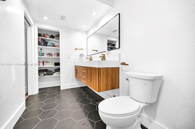 3501 Keyser Ave Unit 43, Hollywood, FL 33021 - bathroom featuring tile patterned flooring, vanity, toilet, recessed lighting, and visible vents