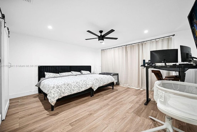 3501 Keyser Ave Unit 43, Hollywood, FL 33021 - bedroom with wood finished floors, baseboards, ceiling fan, recessed lighting, and a barn door