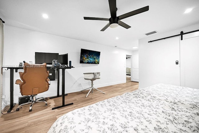 3501 Keyser Ave Unit 43, Hollywood, FL 33021 - bedroom with recessed lighting, visible vents, a barn door, and light wood-style floors