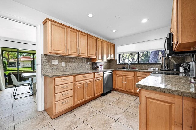 3501 Keyser Ave Unit 43, Hollywood, FL 33021 - kitchen with a sink, appliances with stainless steel finishes, decorative backsplash, and light tile patterned floors