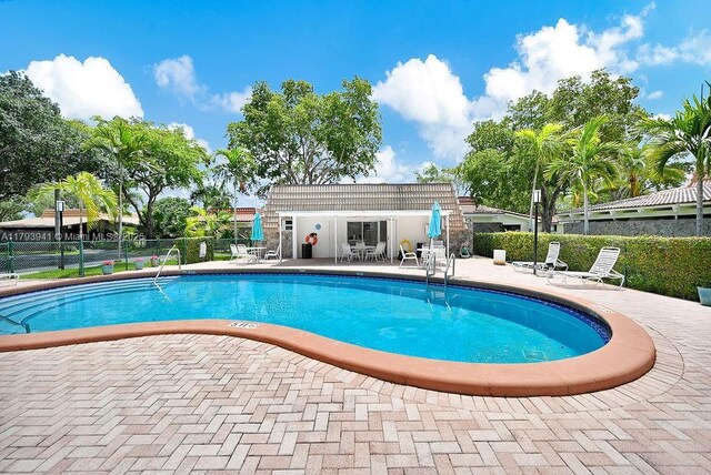 3501 Keyser Ave Unit 43, Hollywood, FL 33021 - community pool featuring a patio area and fence