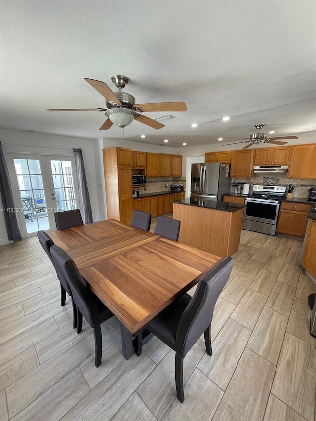 8588 NW 27th Dr, Coral Springs, FL 33065 - dining space featuring french doors, ceiling fan, wood finish floors, and recessed lighting