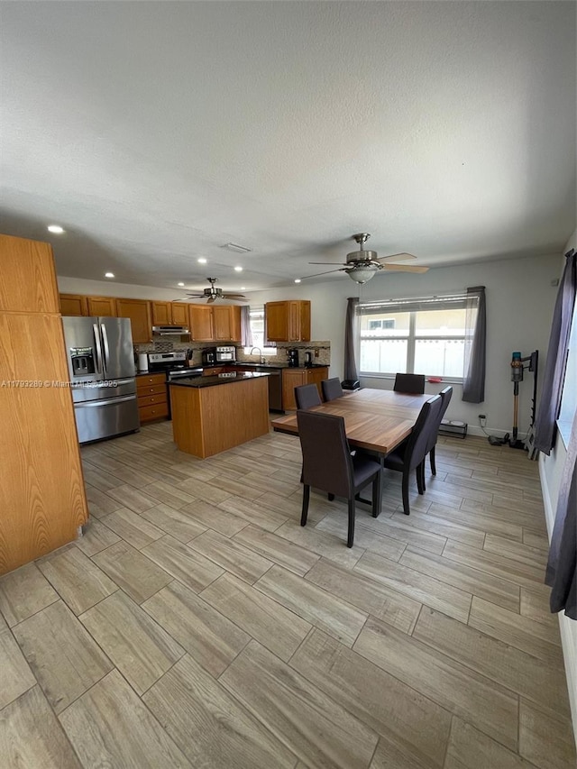 8588 NW 27th Dr, Coral Springs, FL 33065 - dining space with recessed lighting, ceiling fan, wood finish floors, and a textured ceiling