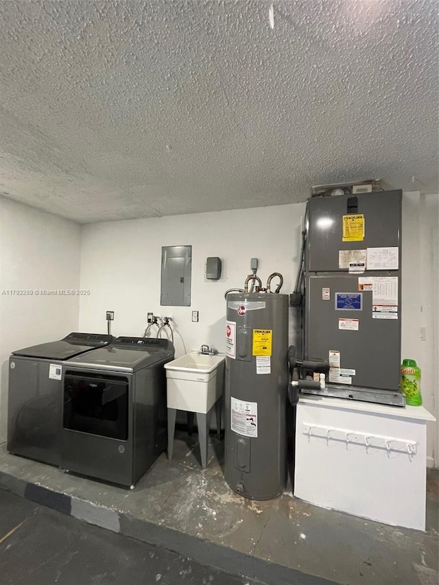 8588 NW 27th Dr, Coral Springs, FL 33065 - laundry area featuring electric panel, laundry area, a textured ceiling, independent washer and dryer, and electric water heater