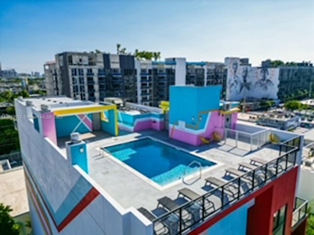 136 NW 26th St Unit 503, Miami, FL 33127 - view of swimming pool featuring a city view and a water play area