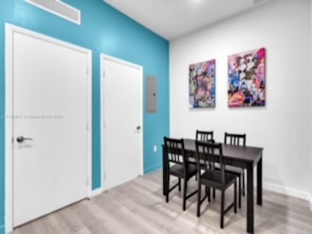 136 NW 26th St Unit 503, Miami, FL 33127 - dining space with light wood-style floors and baseboards