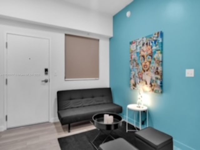 136 NW 26th St Unit 503, Miami, FL 33127 - interior space with baseboards and wood finished floors