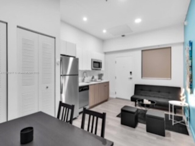 136 NW 26th St Unit 503, Miami, FL 33127 - dining area featuring recessed lighting and light wood-style flooring