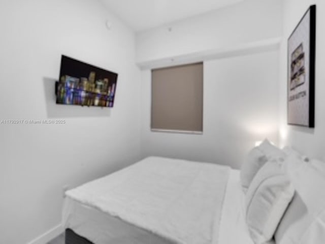 136 NW 26th St Unit 503, Miami, FL 33127 - bedroom featuring baseboards