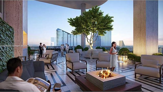 801 S Miami Ave Unit 2505, Miami, FL 33130 - patio terrace at dusk featuring a view of city and an outdoor living space with a fire pit