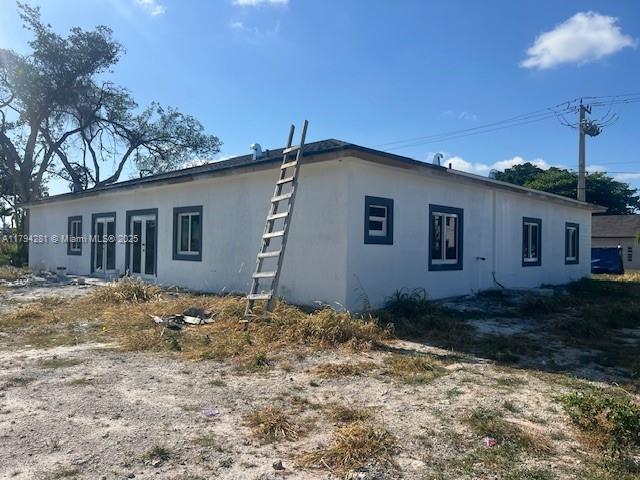 11870 SW 220th St, Miami, FL 33170 - view of property exterior featuring stucco siding