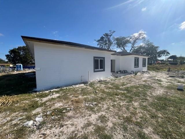 11870 SW 220th St, Miami, FL 33170 - rear view of house featuring stucco siding
